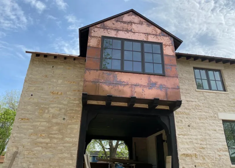 Copper metal panel facade on a stone building for Skylight Installation in West Miami